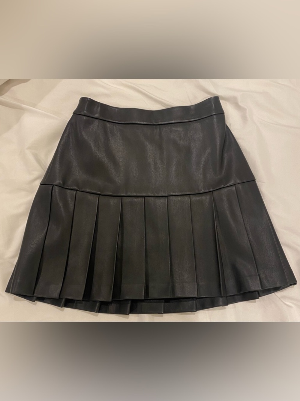 Black Pleated Faux Leather Mini Skirt. Size small.